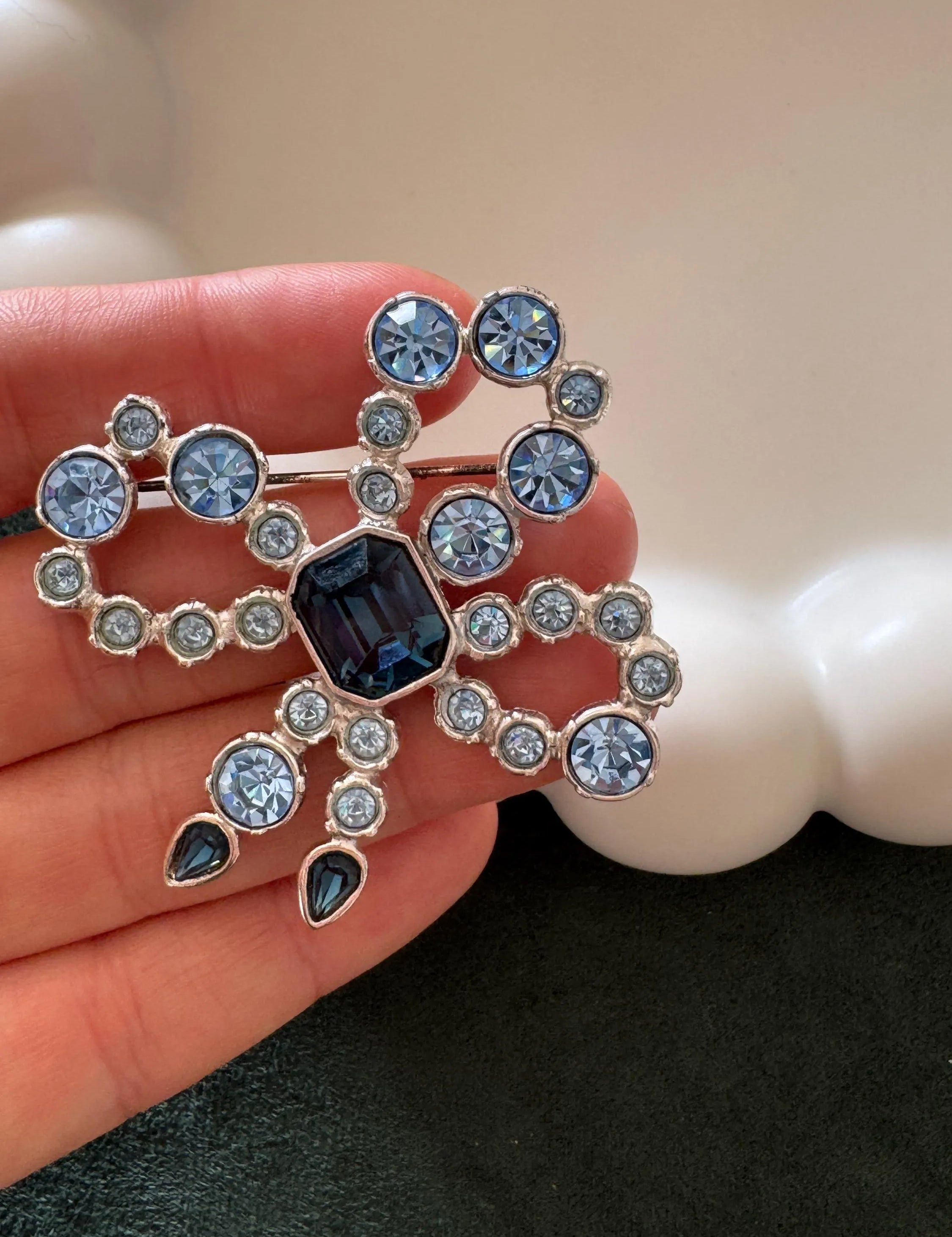 Vintage YSL royal blue cabochon ribbon brooch in silver tone, iconic designer statement jewelry for women