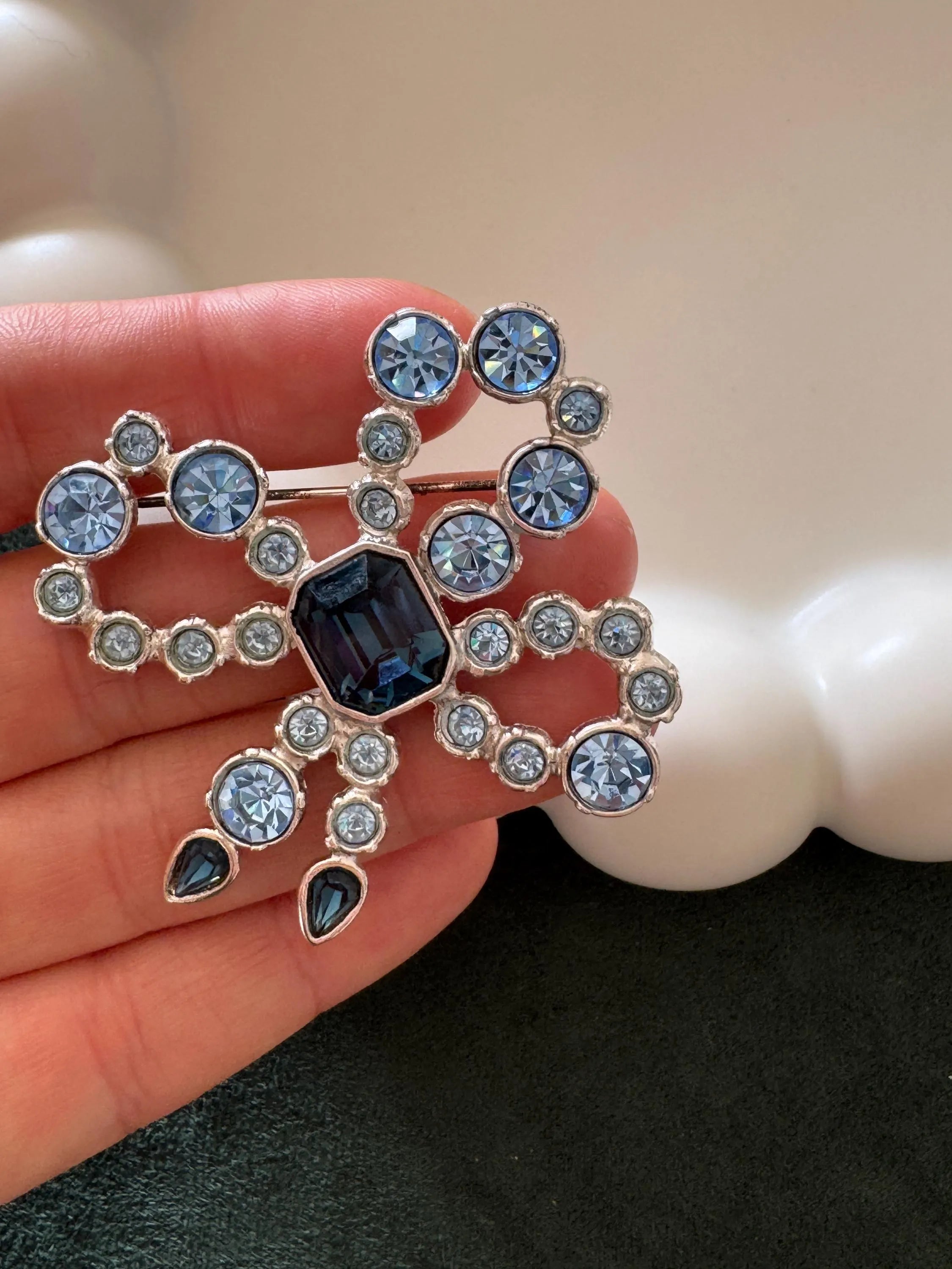Vintage YSL royal blue cabochon ribbon brooch in silver tone, iconic designer statement jewelry for women