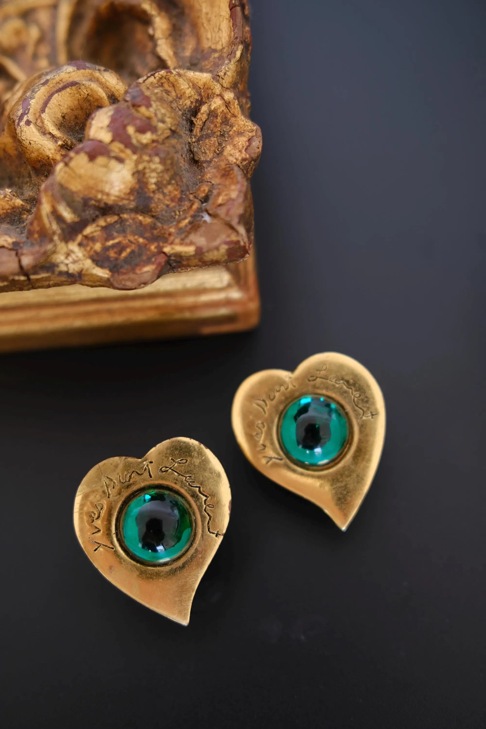 Vintage Yves Saint Laurent gold-tone heart earrings with oval emerald green cabochon front view