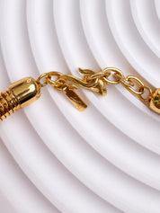 Vintage YSL gold snake chain necklace by Yves Saint Laurent, unisex Y2K designer jewelry with sleek minimalist chain design