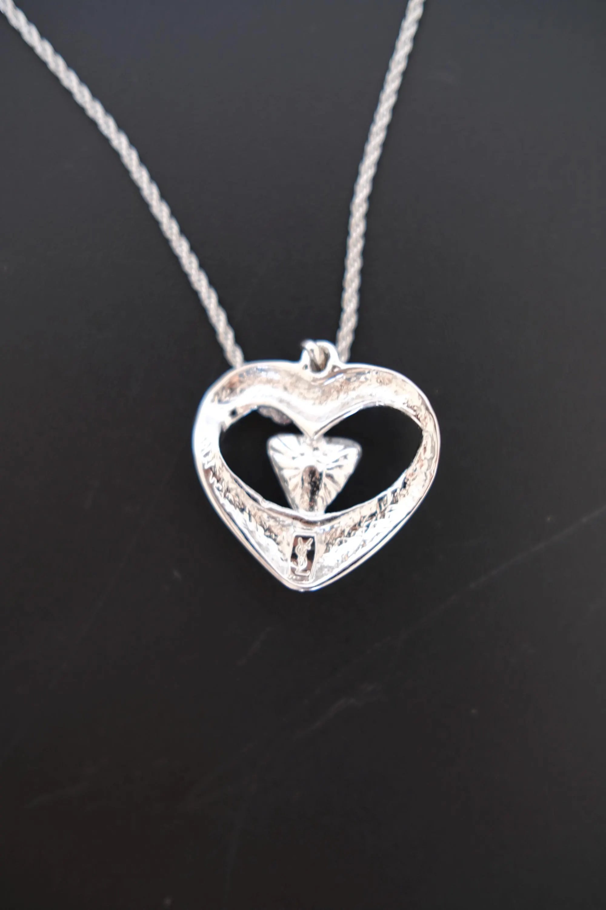 Vintage Yves Saint Laurent openwork heart pendant reverse with YSL signature