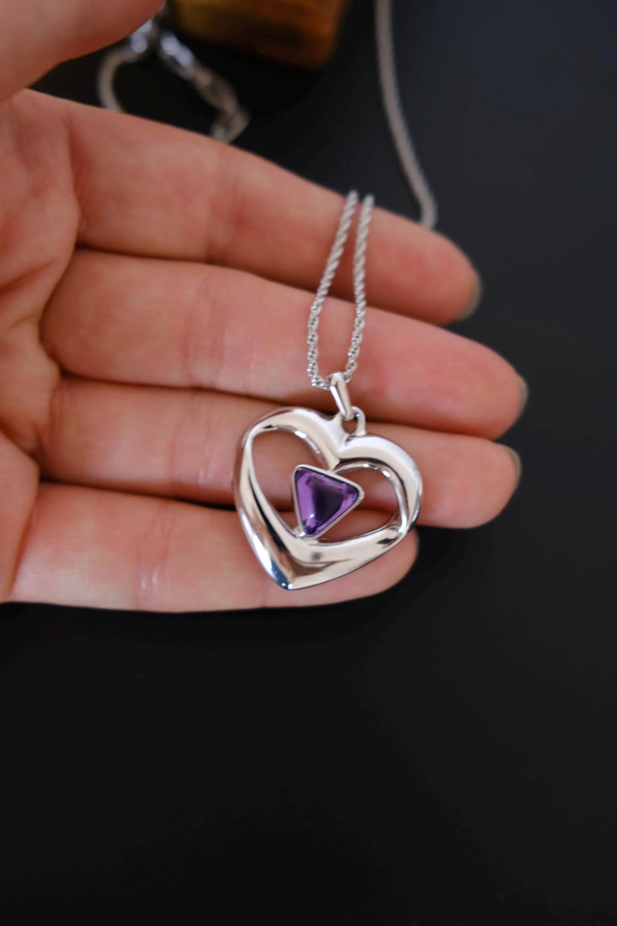 Vintage Yves Saint Laurent sculptural silver-tone openwork heart pendant close-up