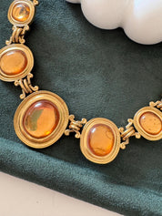 Vintage Yves Saint Laurent cabochon necklace with gold tone finish, timeless designer gift for women