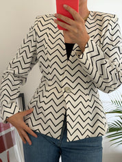 Vintage Yves Saint Laurent zigzag jacket worn with deep V neckline