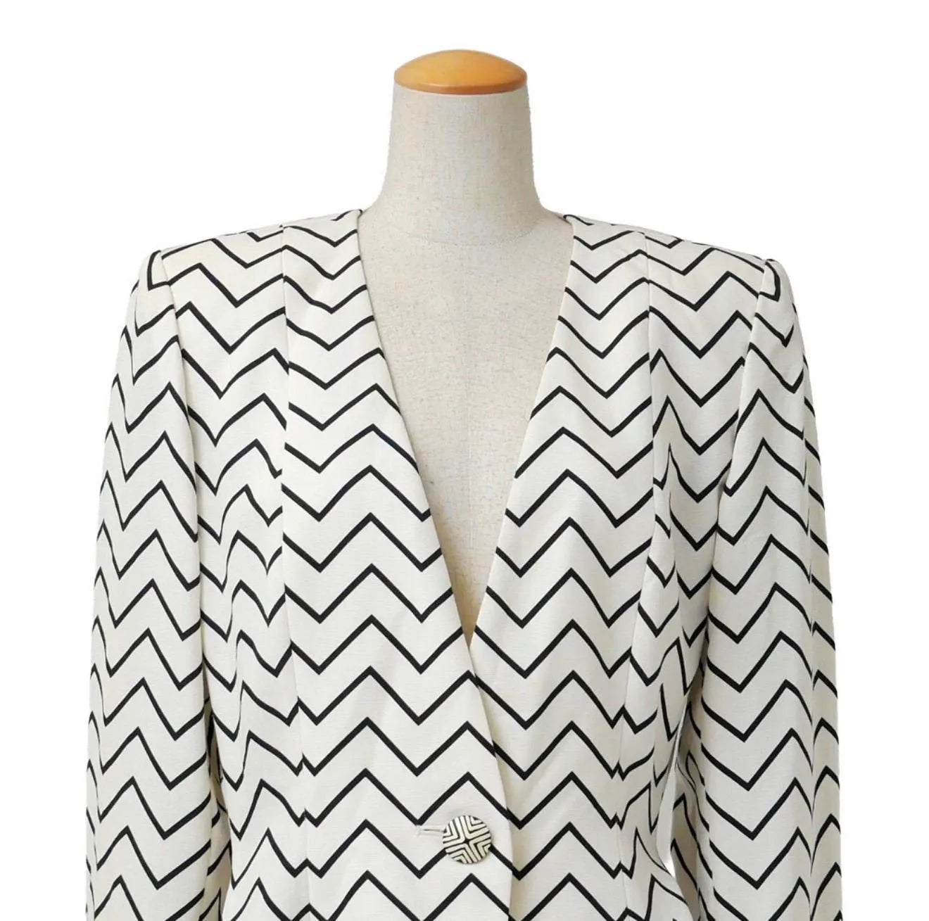 Vintage Yves Saint Laurent zigzag jacket worn with deep V neckline