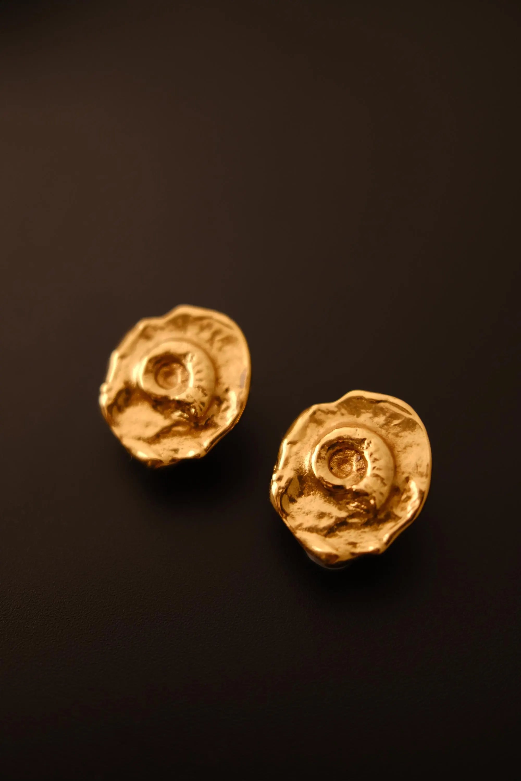 Vintage YSL sculptural seashell earrings textured gold-tone detail