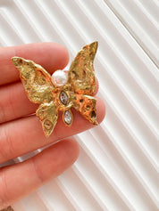 Authentic vintage YSL gold butterfly brooch, refined French designer jewelry with soft pearl detail