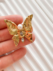 Authentic vintage YSL gold butterfly brooch, refined French designer jewelry with soft pearl detail
