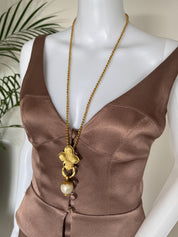 Vintage YSL clover pearl pendant long necklace worn as elegant statement piece