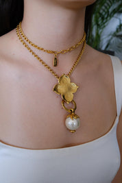 Vintage YSL clover pearl pendant long necklace worn as elegant statement piece