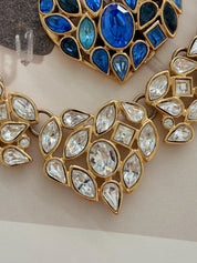 Close-up of faceted crystals on vintage YSL gold tone choker necklace