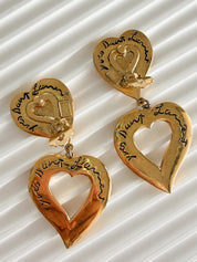 Vintage YSL heart dangle earrings with fluid movement and bold design