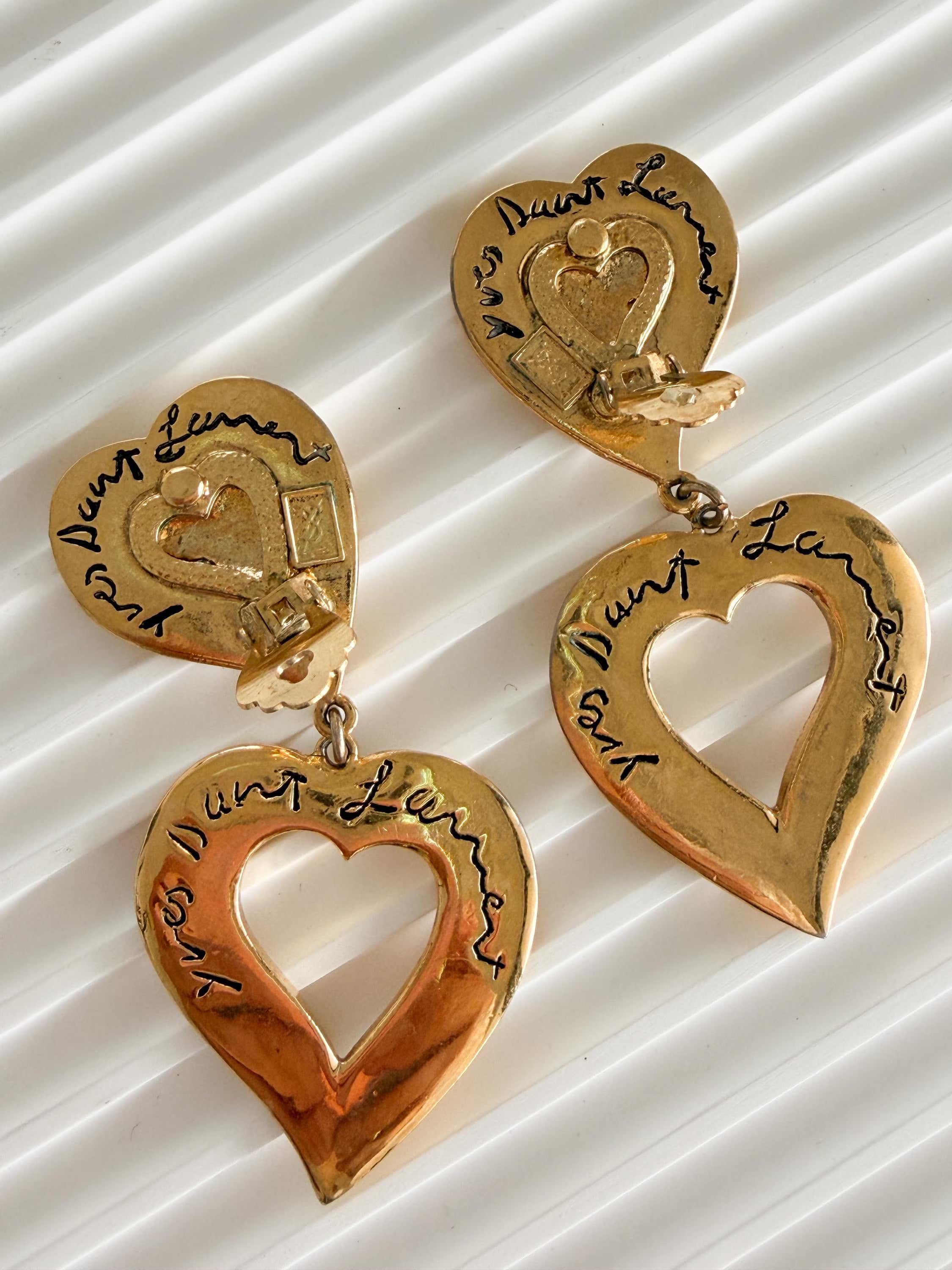 Vintage YSL heart dangle earrings with fluid movement and bold design