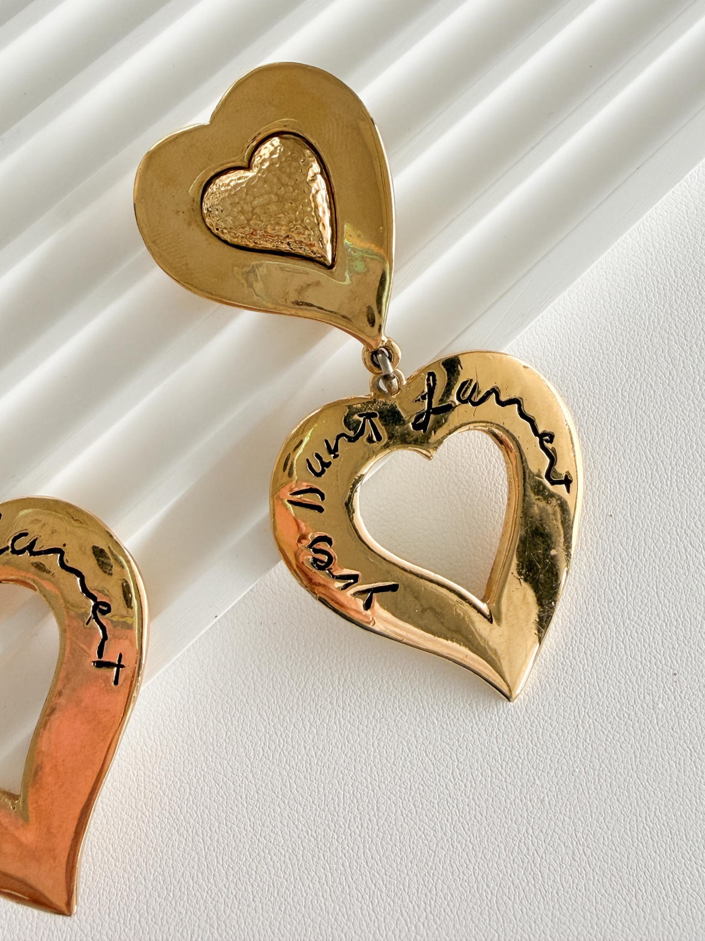 Vintage YSL heart earrings worn as chic parisian statement jewelry