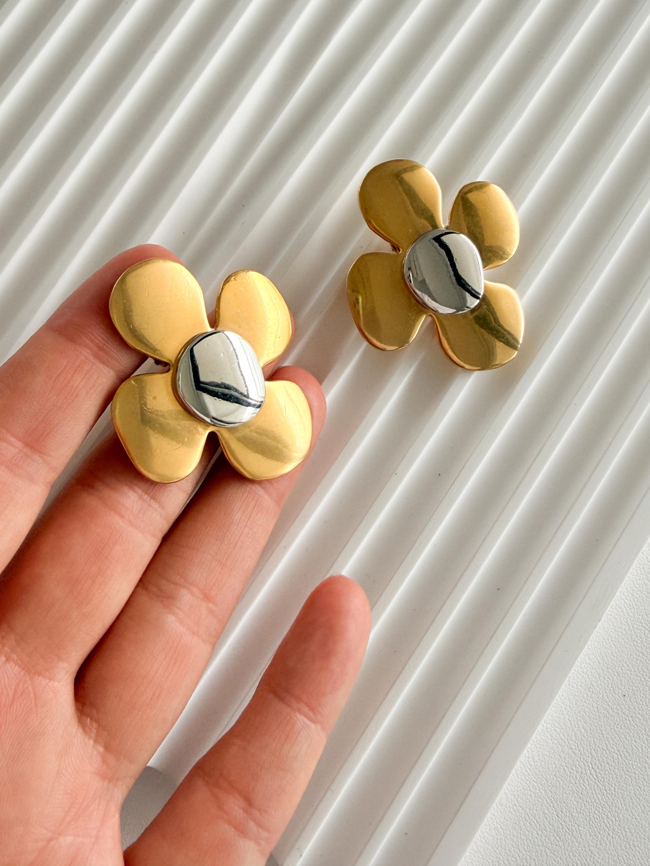 Vintage YSL floral clip-on earrings with bold yet refined silhouette