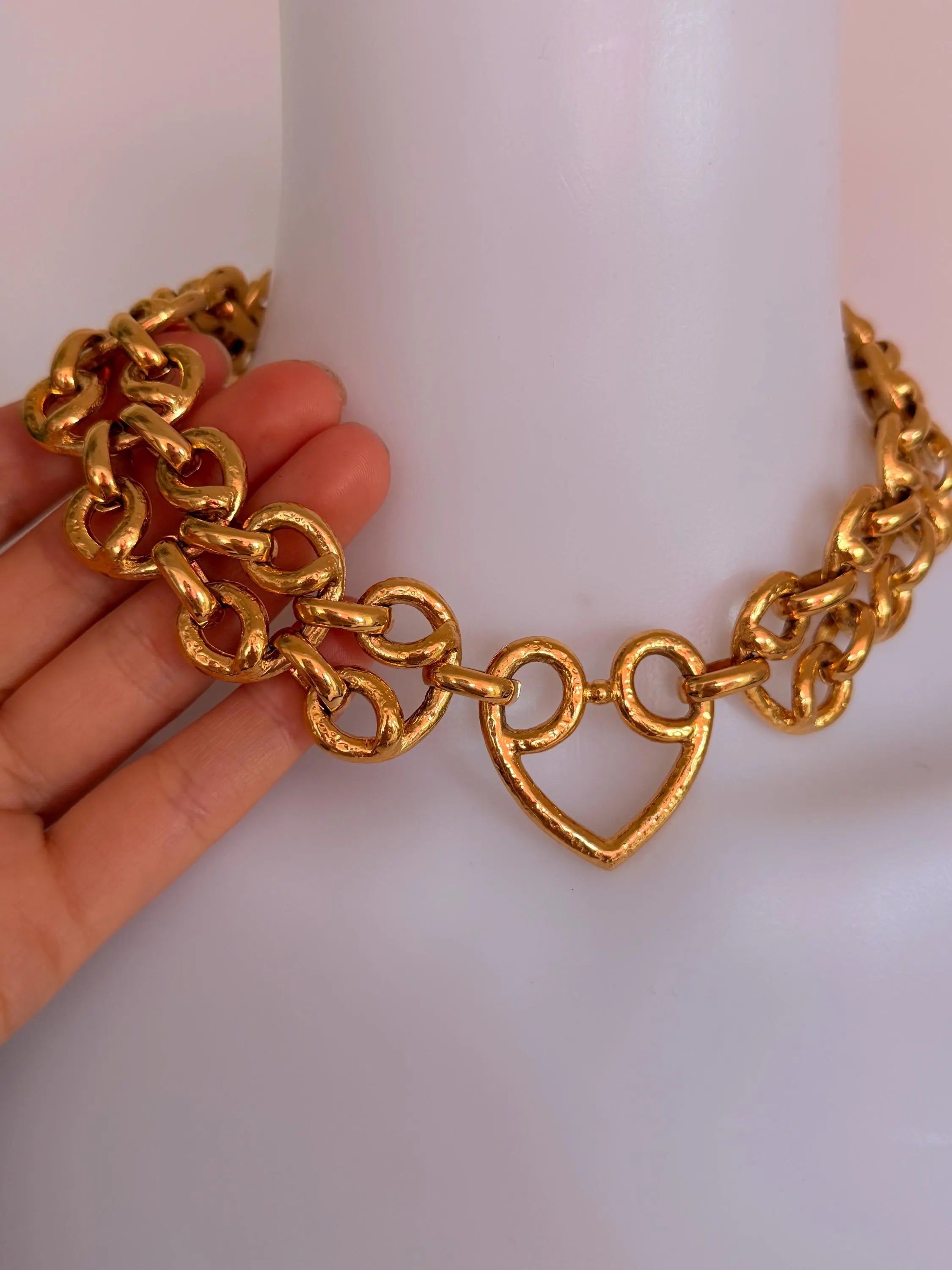 Vintage YSL heart chain necklace worn as iconic bold statement jewelry