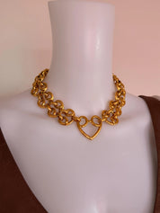 Vintage YSL heart chain necklace worn as iconic bold statement jewelry