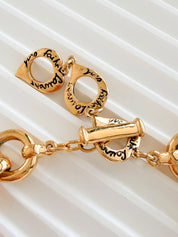 Close-up of chunky gold link chain on vintage YSL statement necklace