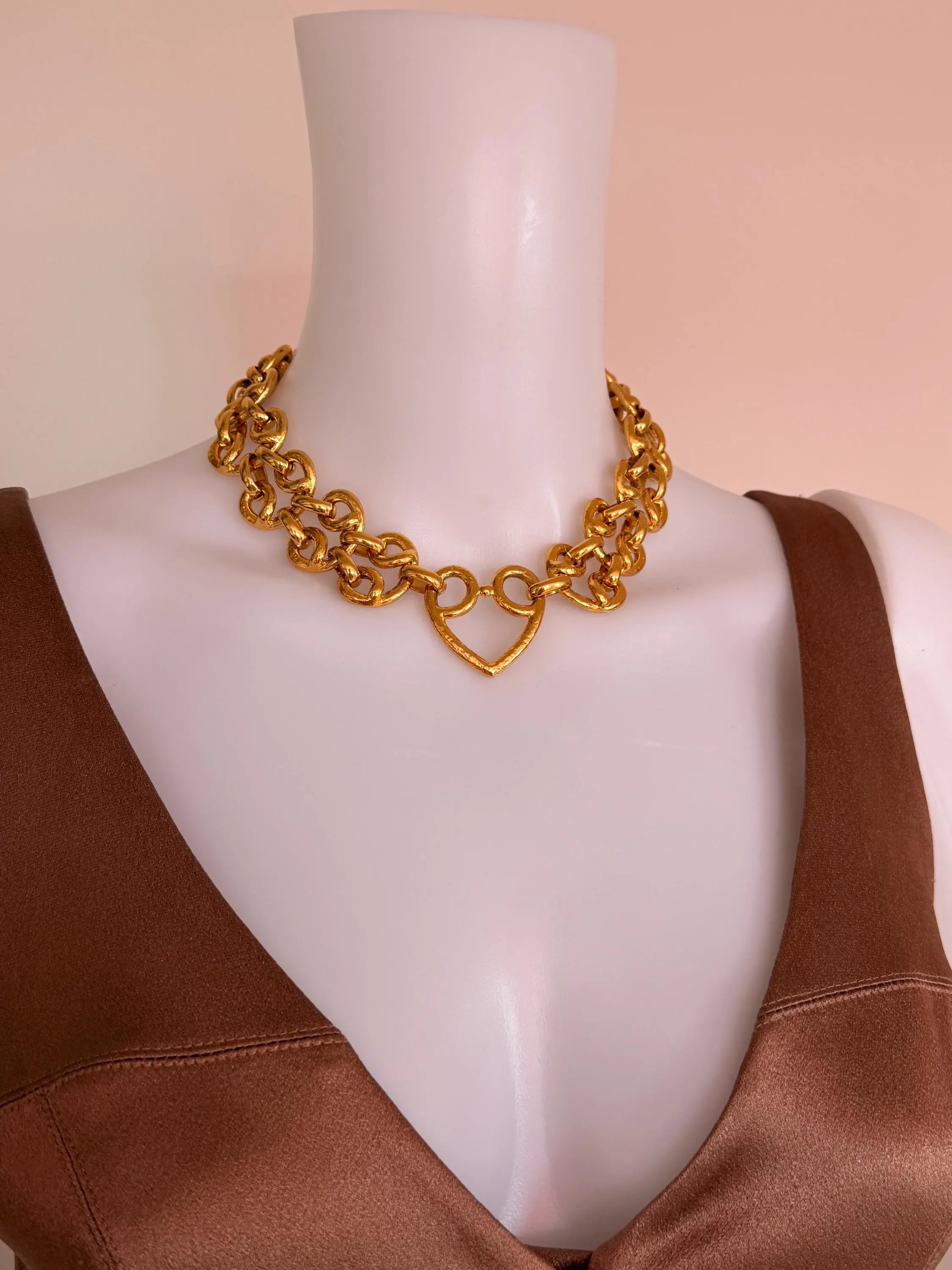 Vintage YSL heart chain necklace worn as iconic bold statement jewelry