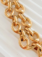 Close-up of chunky gold link chain on vintage YSL statement necklace
