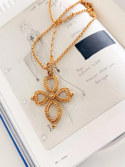 Vintage Yves Saint Laurent gold tone openwork cross pendant long necklace elegant design