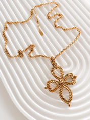 Vintage Yves Saint Laurent gold tone openwork cross pendant long necklace elegant design