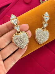 Vintage YSL crystal heart earrings worn as elegant statement jewelry