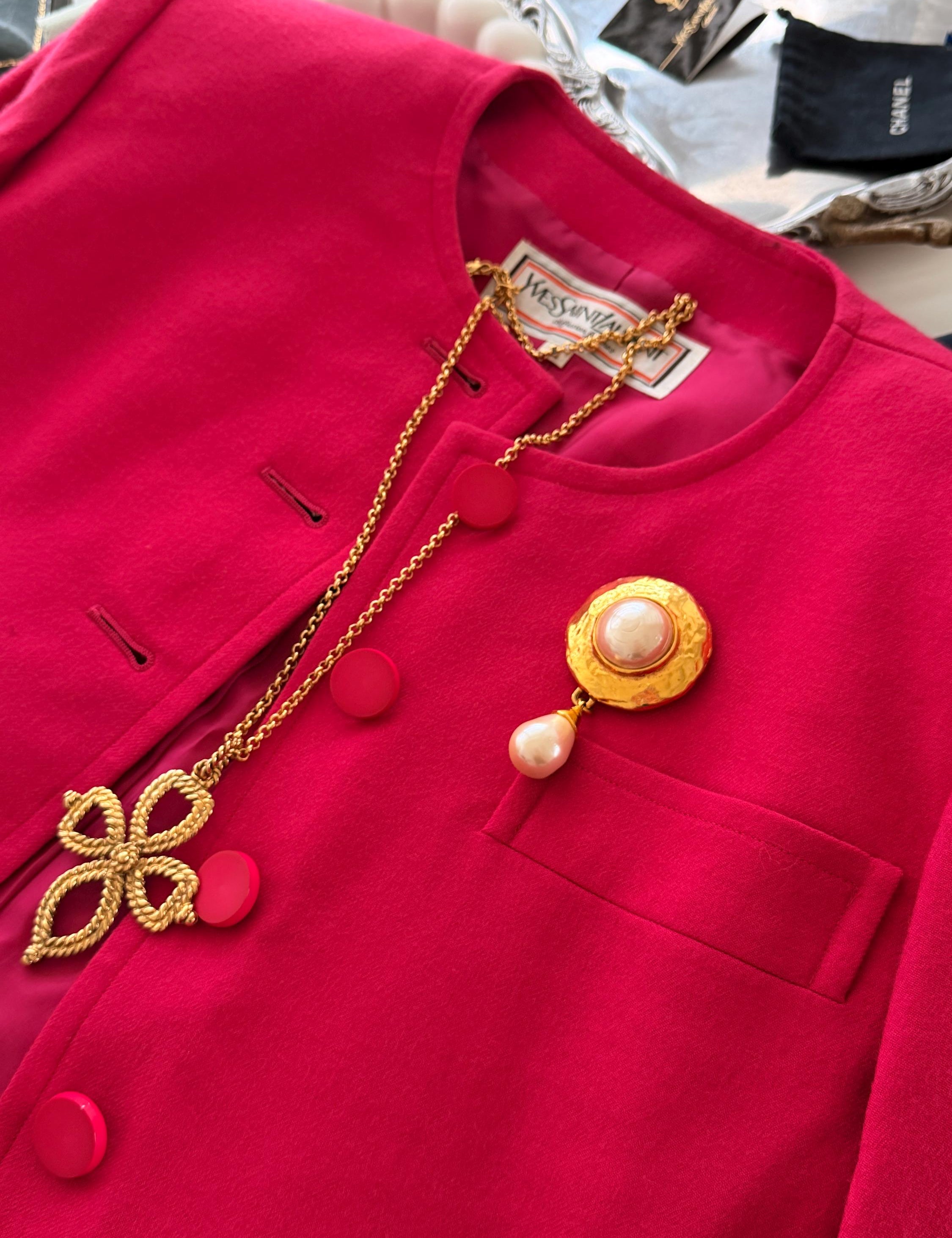 Vintage Yves Saint Laurent gold tone pearl charm dangle brooch elegant statement piece