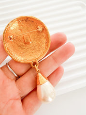 Vintage Yves Saint Laurent gold tone pearl charm dangle brooch elegant statement piece