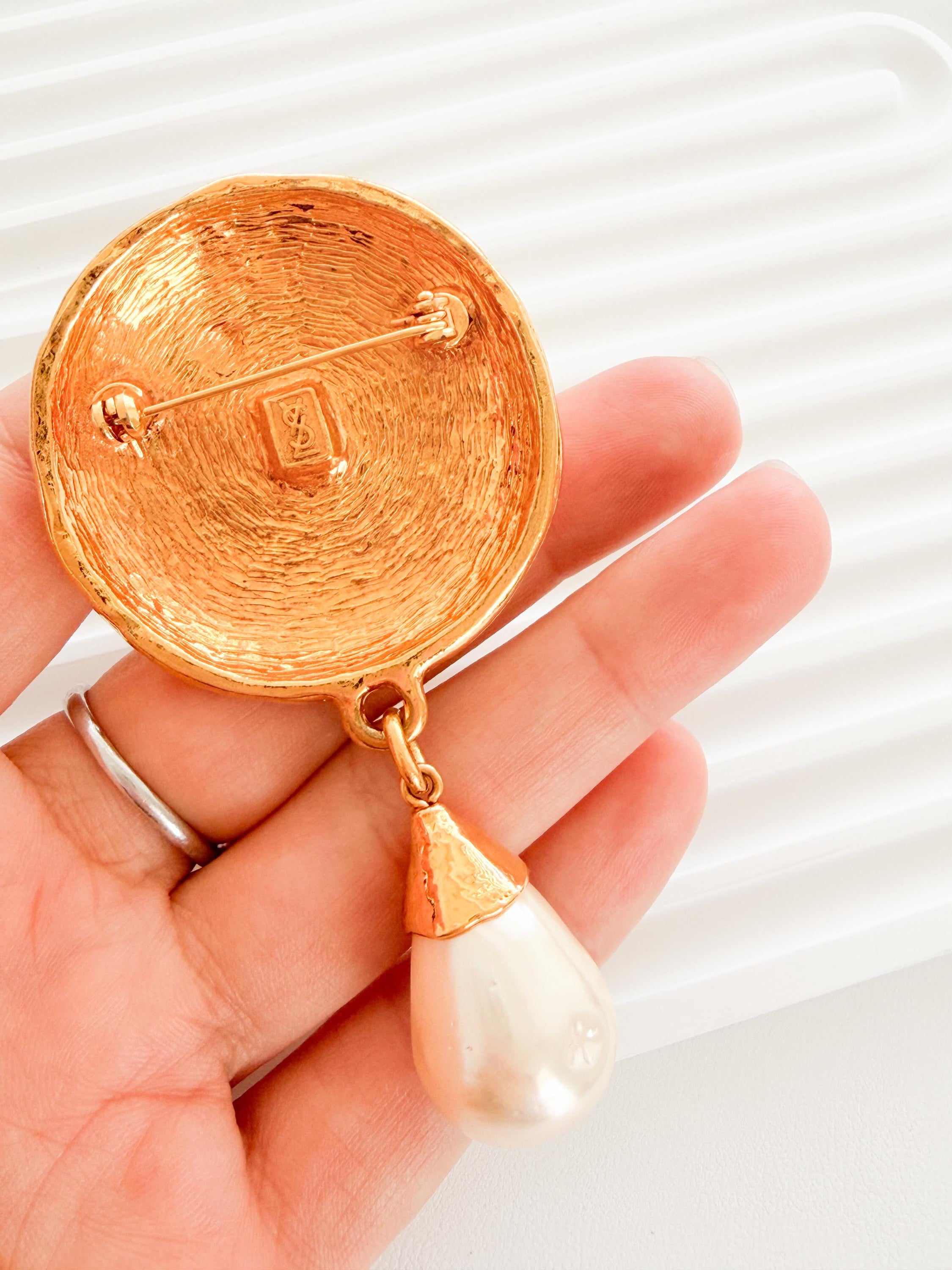 Vintage Yves Saint Laurent gold tone pearl charm dangle brooch elegant statement piece