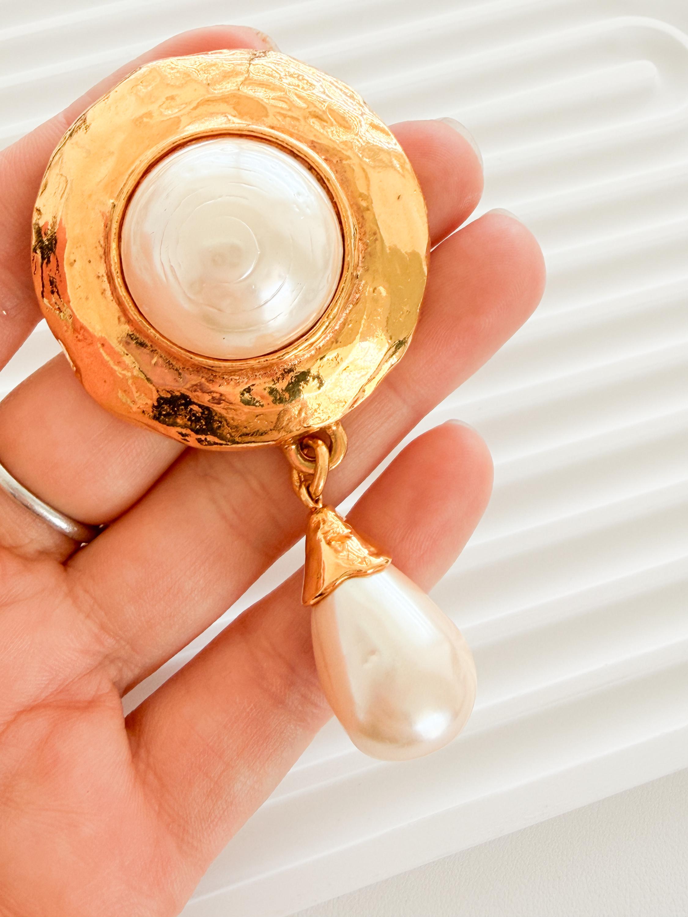 Vintage YSL pearl dangle brooch worn as elegant luxury statement jewelry