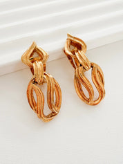 Authentic Vintage YSL Yves Saint Laurent gold sculptural link clip-on dangle earrings iconic statement