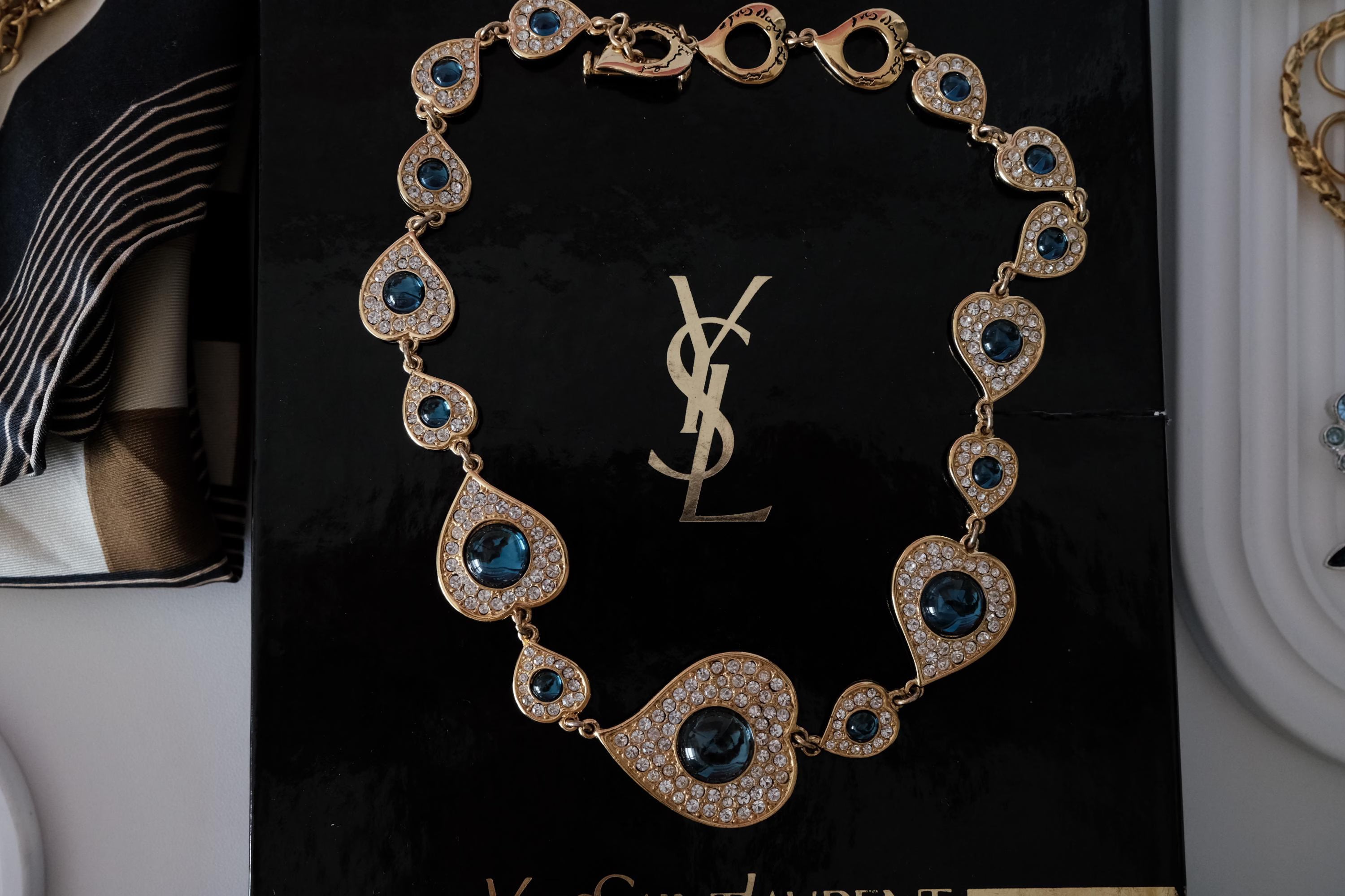 Vintage YSL Yves Saint Laurent heart necklace with blue cabochon and crystal accents in gold tone