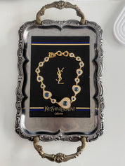 Vintage YSL gold tone heart link necklace with royal blue cabochon and crystals