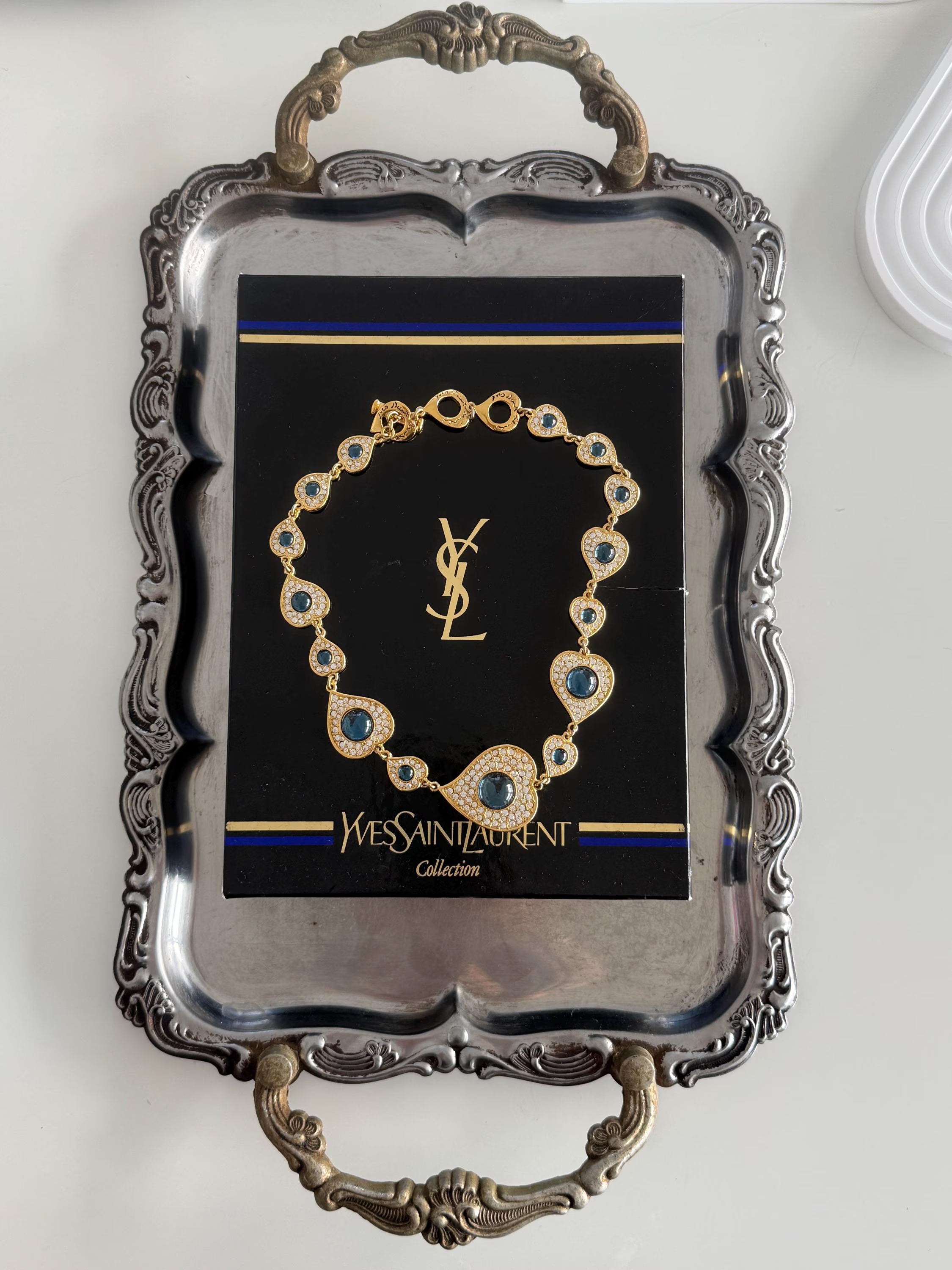 Vintage YSL gold tone heart link necklace with royal blue cabochon and crystals