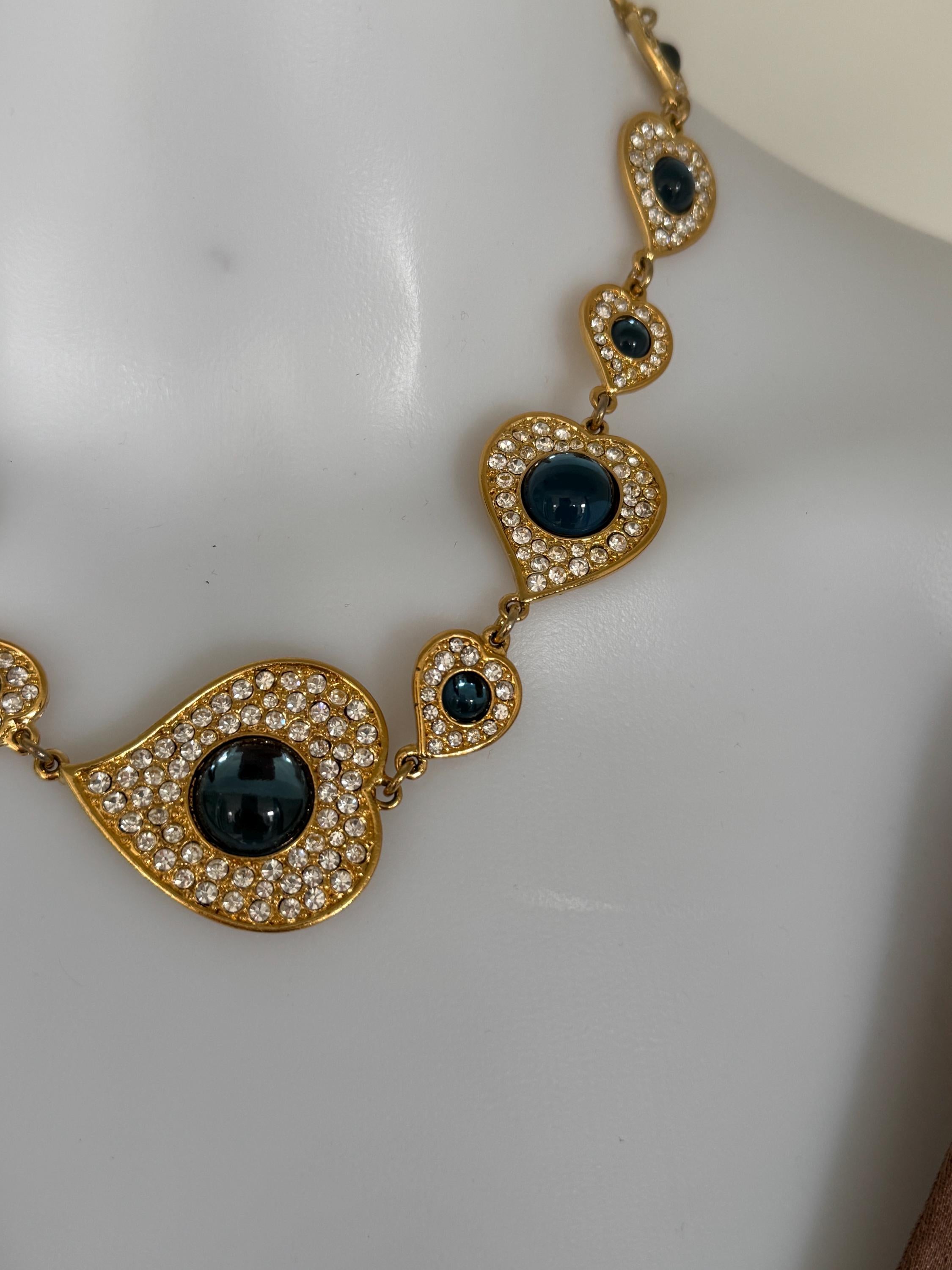 Vintage YSL heart necklace worn as elegant gold tone statement jewelry