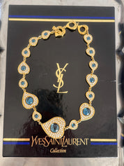 Vintage YSL heart necklace worn as elegant gold tone statement jewelry