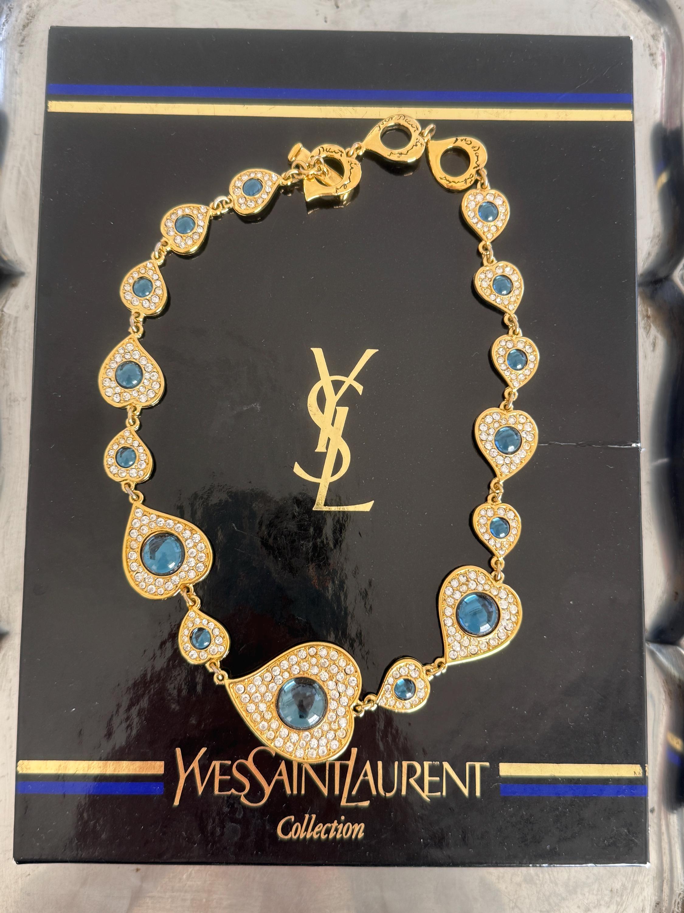 Vintage YSL heart necklace worn as elegant gold tone statement jewelry