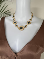 Vintage YSL gold tone heart link necklace with royal blue cabochon and crystals