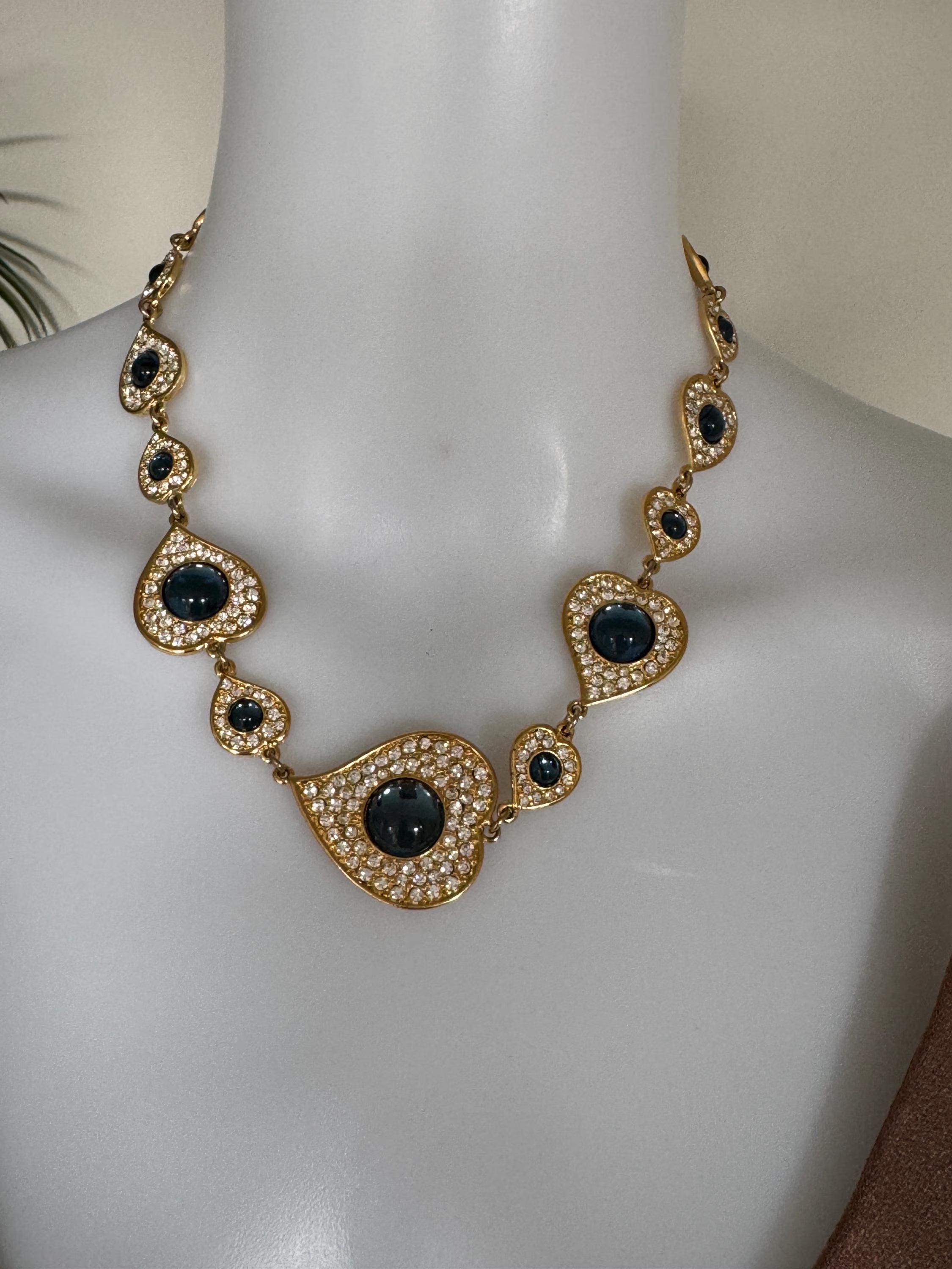 Vintage YSL heart necklace worn as elegant gold tone statement jewelry