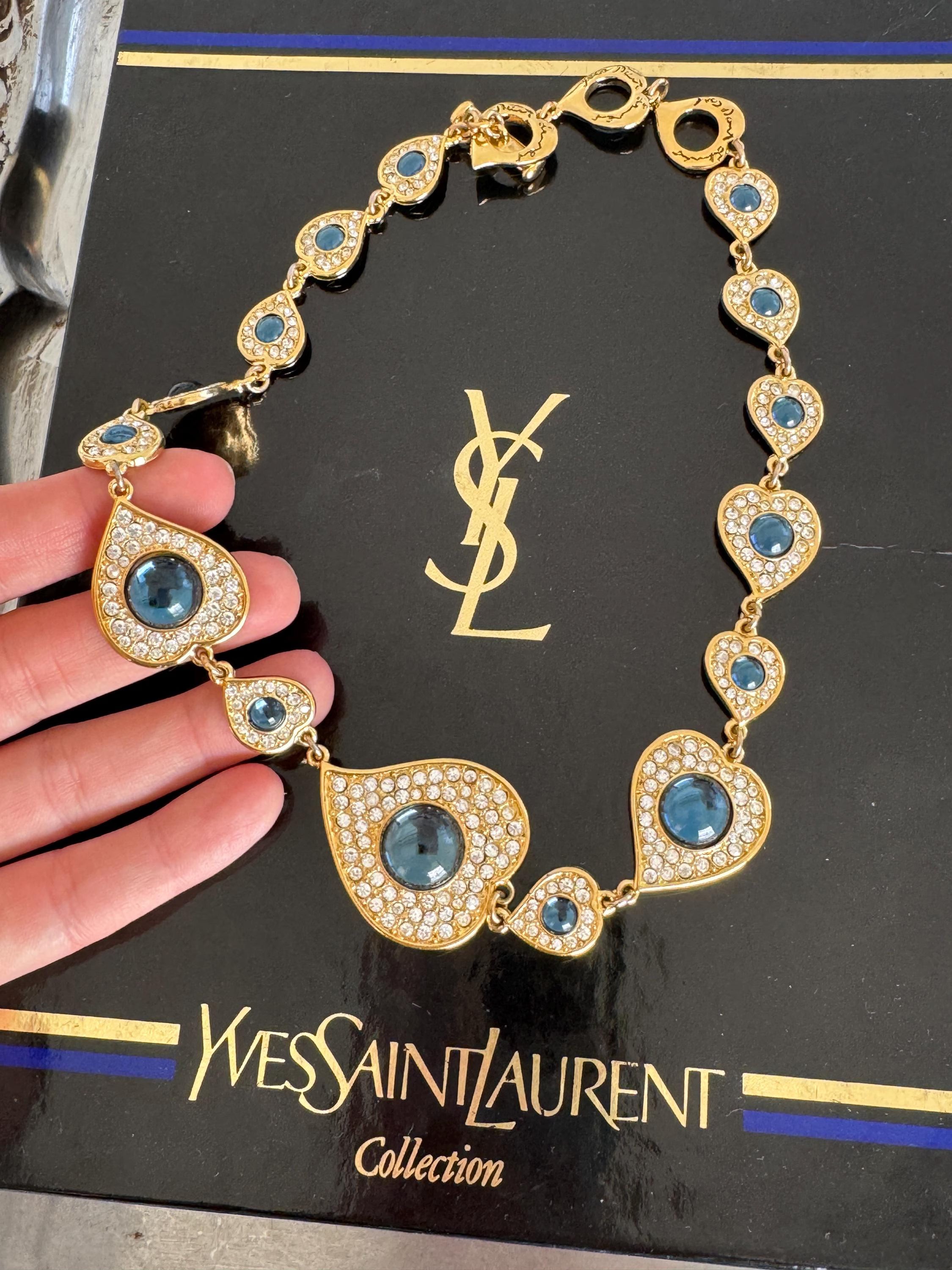 Vintage YSL Yves Saint Laurent heart necklace with blue cabochon and crystal accents in gold tone