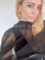 Vintage YSL gold tone spiral clip-on dangle earrings with massive statement design