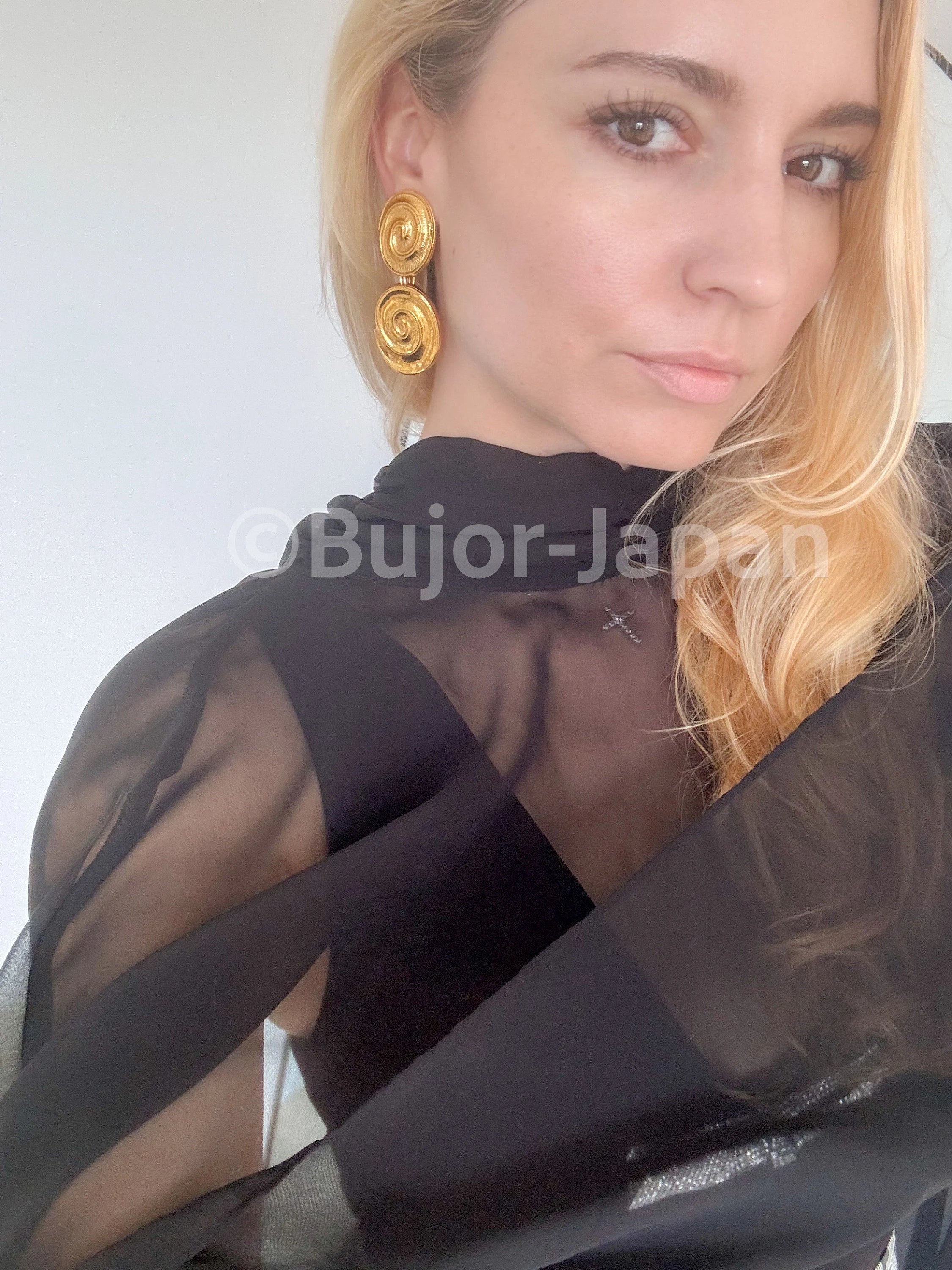 Vintage YSL gold tone spiral clip-on dangle earrings with massive statement design