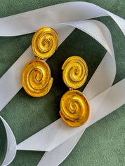 Vintage YSL gold tone spiral clip-on dangle earrings with massive statement design