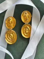 Vintage YSL gold tone spiral clip-on dangle earrings with massive statement design