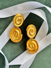 Vintage YSL gold tone spiral clip-on dangle earrings with massive statement design