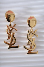 Authentic YSL Yves Saint Laurent vintage gold tone iconic logo drop earrings, made in France, extremely rare collector piece
