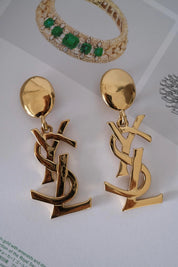 Authentic YSL Yves Saint Laurent vintage gold tone iconic logo drop earrings, made in France, extremely rare collector piece
