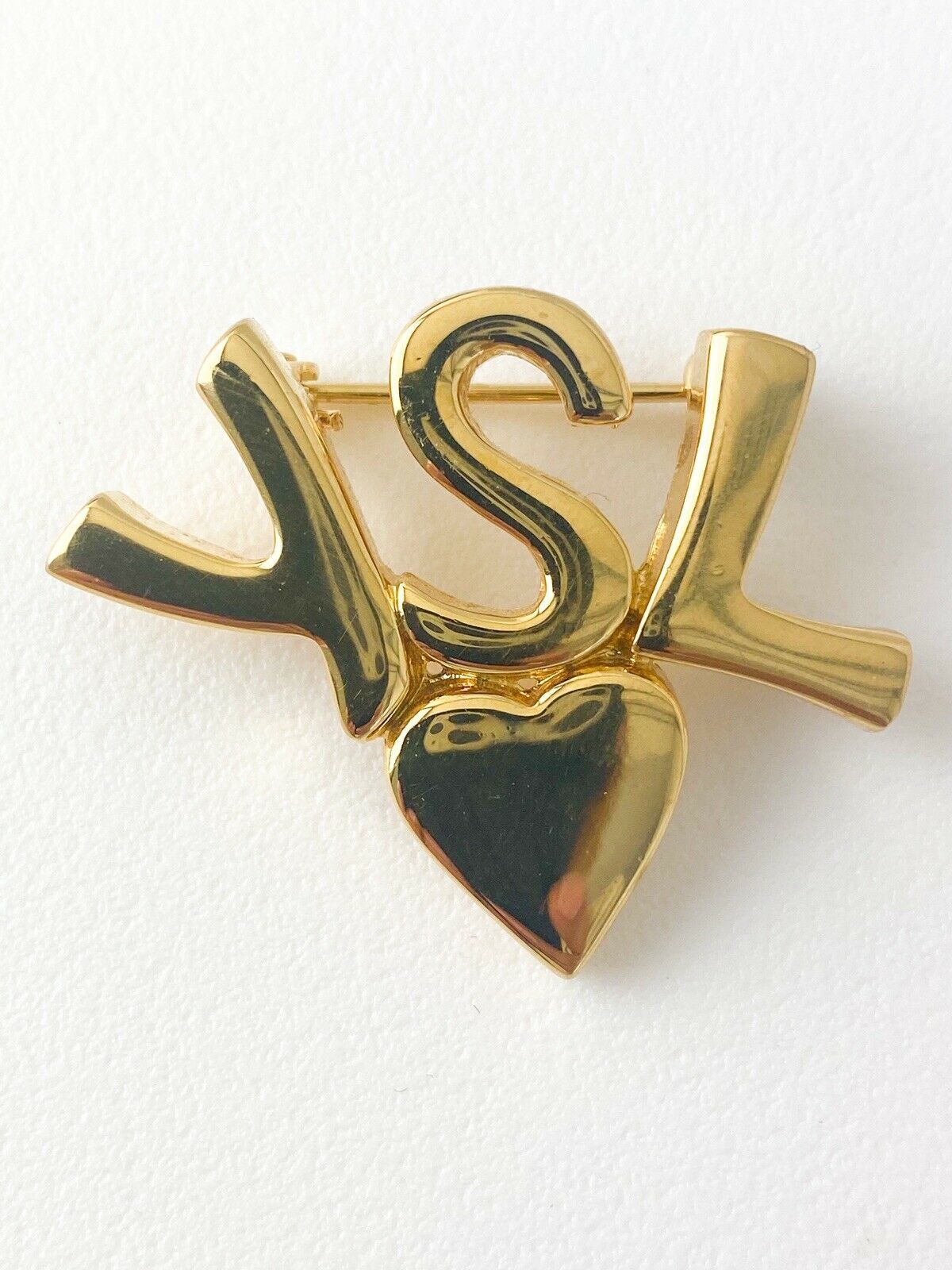 Vintage Yves Saint Laurent heart logo pink brooch 