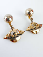 Moschino Vintage Star Saturn Planet Dangle Earrings Gold Tone Logo